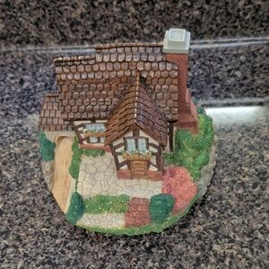 Charming Cottage Figurine with Brown and Green Accents